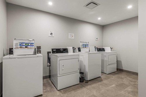 402-1315 Spring Creek Gate, Canmore, AB - Indoor Photo Showing Laundry Room