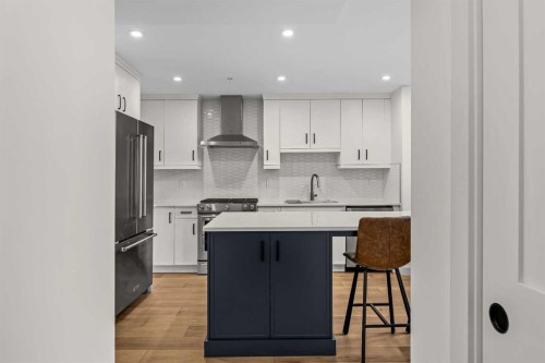 402-1315 Spring Creek Gate, Canmore, AB - Indoor Photo Showing Kitchen With Upgraded Kitchen