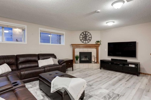 117 Cramond Crescent Se, Calgary, AB - Indoor Photo Showing Living Room With Fireplace