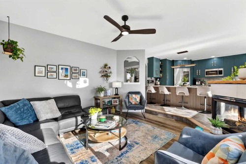 61 Somerset Crescent Sw, Calgary, AB - Indoor Photo Showing Living Room With Fireplace