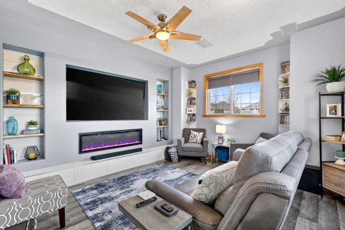 61 Somerset Crescent Sw, Calgary, AB - Indoor Photo Showing Living Room With Fireplace