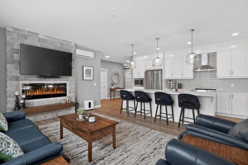 105-55 Wolf Hollow Crescent Se, Calgary, AB - Indoor Photo Showing Living Room With Fireplace