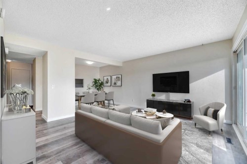 29-131 Templehill Drive Ne, Calgary, AB - Indoor Photo Showing Living Room With Fireplace