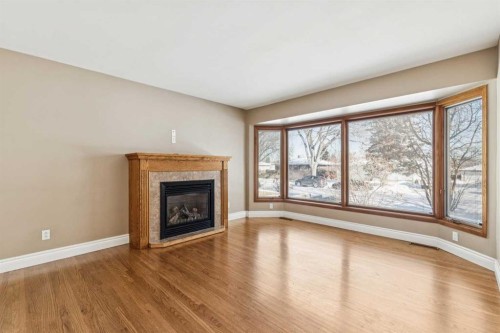5415 Centre A Street Ne, Calgary, AB - Indoor Photo Showing Living Room With Fireplace