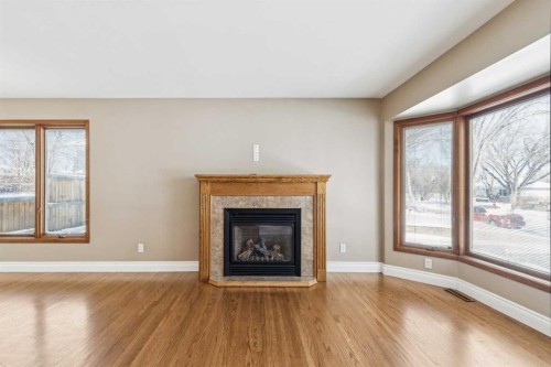 5415 Centre A Street Ne, Calgary, AB - Indoor Photo Showing Living Room With Fireplace