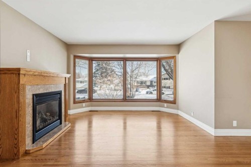 5415 Centre A Street Ne, Calgary, AB - Indoor Photo Showing Living Room With Fireplace