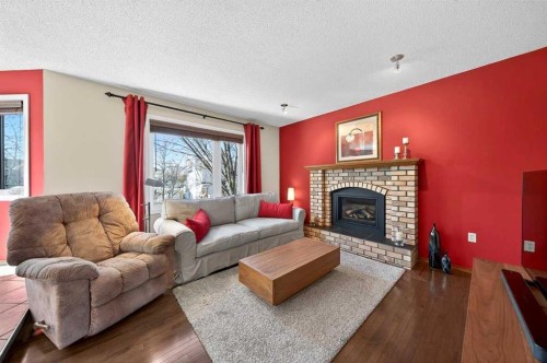 228 Riverside Close Se, Calgary, AB - Indoor Photo Showing Living Room With Fireplace