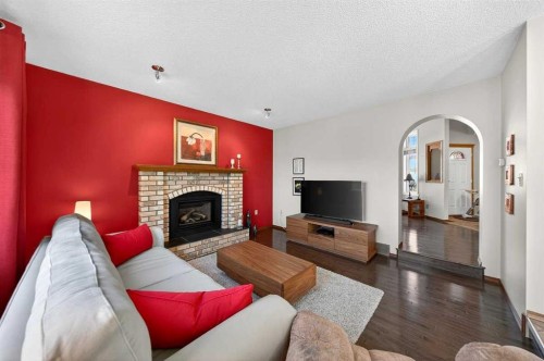 228 Riverside Close Se, Calgary, AB - Indoor Photo Showing Living Room With Fireplace