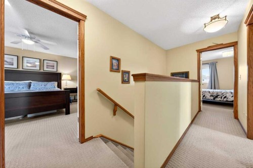 228 Riverside Close Se, Calgary, AB - Indoor Photo Showing Bedroom