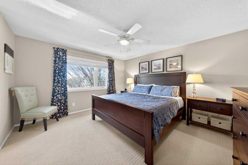 228 Riverside Close Se, Calgary, AB - Indoor Photo Showing Bedroom