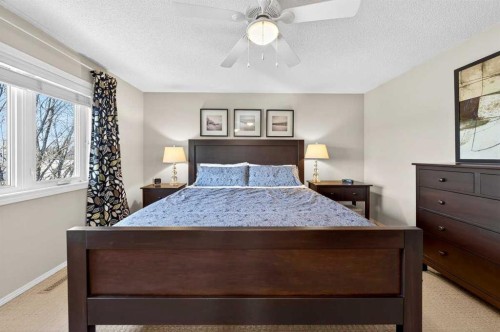228 Riverside Close Se, Calgary, AB - Indoor Photo Showing Bedroom