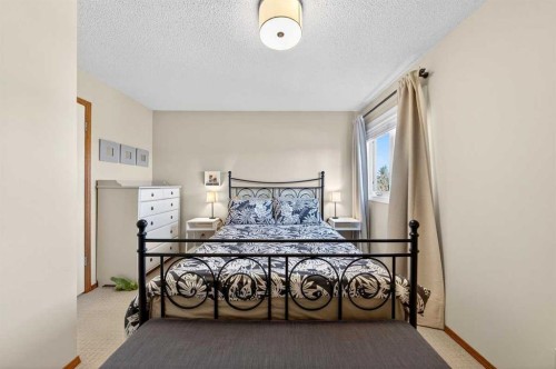 228 Riverside Close Se, Calgary, AB - Indoor Photo Showing Bedroom