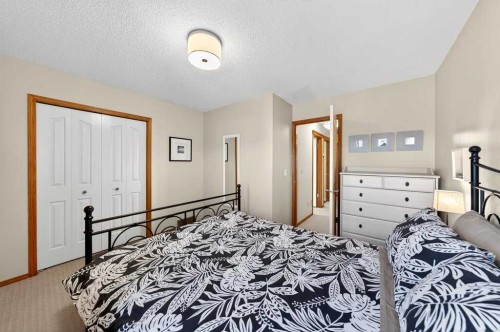 228 Riverside Close Se, Calgary, AB - Indoor Photo Showing Bedroom