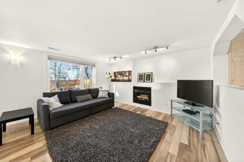 228 Riverside Close Se, Calgary, AB - Indoor Photo Showing Living Room With Fireplace
