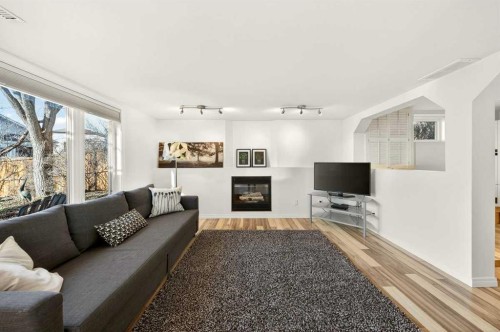 228 Riverside Close Se, Calgary, AB - Indoor Photo Showing Living Room With Fireplace