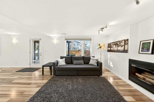 228 Riverside Close Se, Calgary, AB - Indoor Photo Showing Living Room With Fireplace