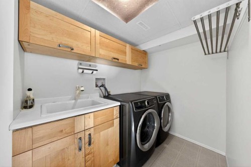 228 Riverside Close Se, Calgary, AB - Indoor Photo Showing Laundry Room