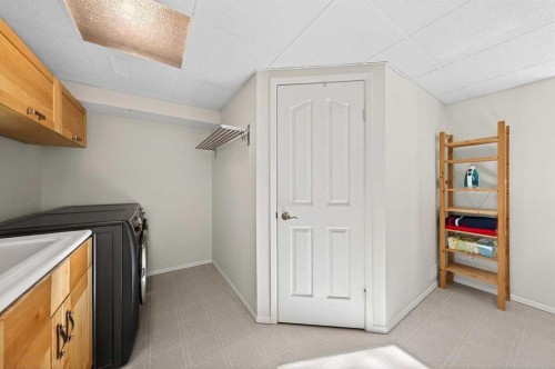 228 Riverside Close Se, Calgary, AB - Indoor Photo Showing Laundry Room