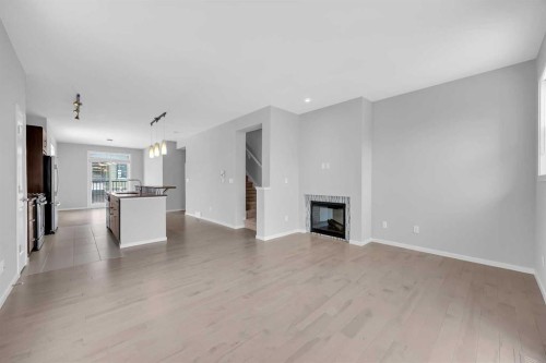 455 Ascot Circle Sw, Calgary, AB - Indoor Photo Showing Living Room With Fireplace