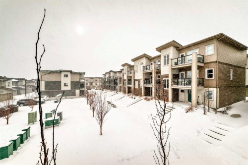 44 Spring Creek Common Sw, Calgary, AB - Outdoor With Balcony With Facade