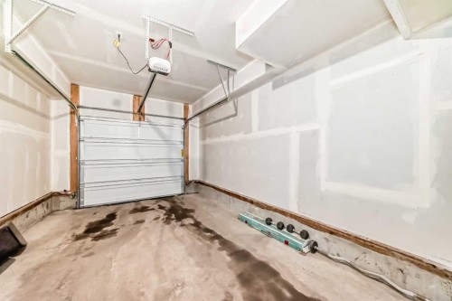 44 Spring Creek Common Sw, Calgary, AB - Indoor Photo Showing Garage