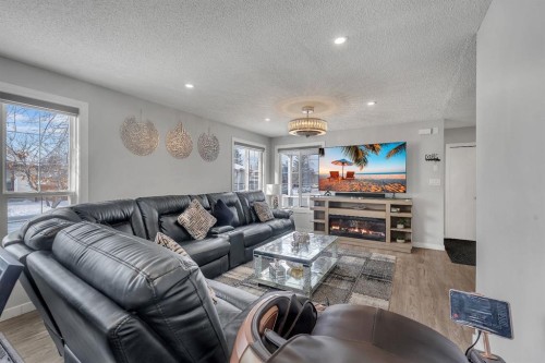 55 Castleglen Way Ne, Calgary, AB - Indoor Photo Showing Living Room With Fireplace
