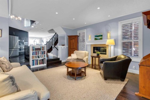 448 13 Street Nw, Calgary, AB - Indoor Photo Showing Living Room With Fireplace