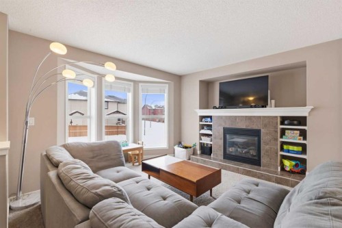 35 Sage Hill Way Nw, Calgary, AB - Indoor Photo Showing Living Room With Fireplace