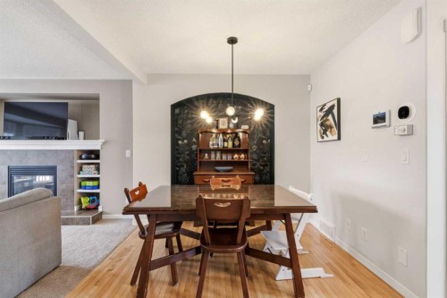 35 Sage Hill Way Nw, Calgary, AB - Indoor Photo Showing Dining Room With Fireplace
