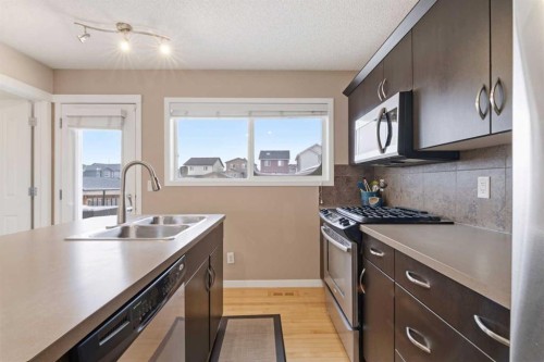35 Sage Hill Way Nw, Calgary, AB - Indoor Photo Showing Kitchen With Double Sink