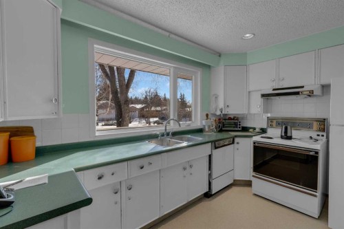 9628 Palisan Place Sw, Calgary, AB - Indoor Photo Showing Kitchen With Double Sink