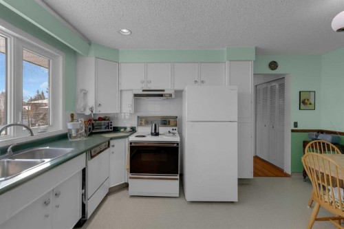 9628 Palisan Place Sw, Calgary, AB - Indoor Photo Showing Kitchen With Double Sink