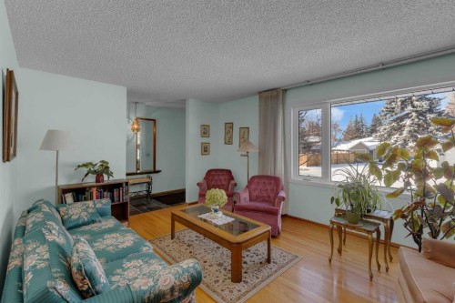 9628 Palisan Place Sw, Calgary, AB - Indoor Photo Showing Living Room