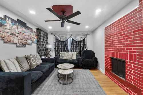 6003 Pinepoint Drive Ne, Calgary, AB - Indoor Photo Showing Living Room With Fireplace