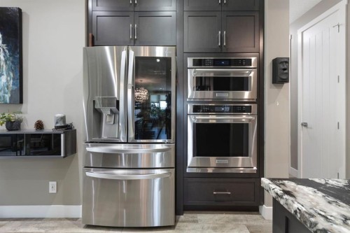 13 Arrowleaf Landing, Rural Rocky View County, AB - Indoor Photo Showing Kitchen With Stainless Steel Kitchen With Upgraded Kitchen