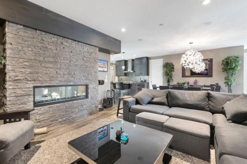 13 Arrowleaf Landing, Rural Rocky View County, AB - Indoor Photo Showing Living Room With Fireplace