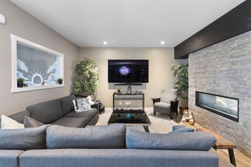 13 Arrowleaf Landing, Rural Rocky View County, AB - Indoor Photo Showing Living Room With Fireplace