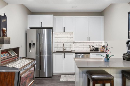 13 Arrowleaf Landing, Rural Rocky View County, AB - Indoor Photo Showing Kitchen With Stainless Steel Kitchen With Double Sink