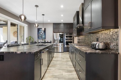 13 Arrowleaf Landing, Rural Rocky View County, AB - Indoor Photo Showing Kitchen With Stainless Steel Kitchen With Upgraded Kitchen