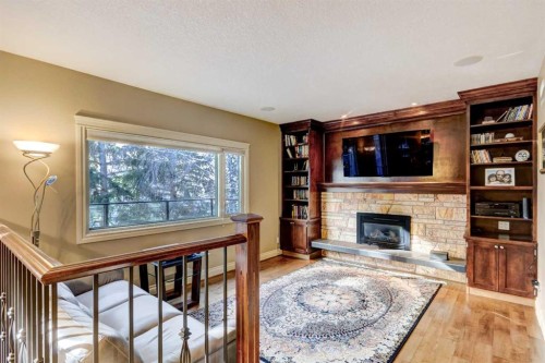 851 Edgemont Road Nw, Calgary, AB - Indoor Photo Showing Living Room With Fireplace