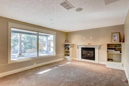 851 Edgemont Road Nw, Calgary, AB - Indoor Photo Showing Living Room With Fireplace