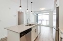 4111-200 Seton Circle Se, Calgary, AB  - Indoor Photo Showing Kitchen With Double Sink With Upgraded Kitchen 