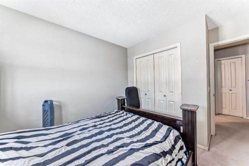 147 Saddlebrook Point Ne, Calgary, AB - Indoor Photo Showing Bedroom