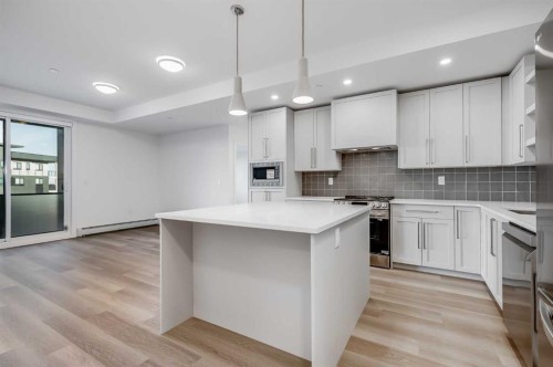1308-520 Reynolds Avenue Sw, Airdrie, AB - Indoor Photo Showing Kitchen With Upgraded Kitchen