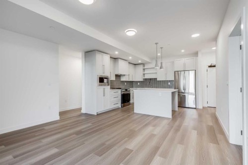 1308-520 Reynolds Avenue Sw, Airdrie, AB - Indoor Photo Showing Kitchen With Upgraded Kitchen