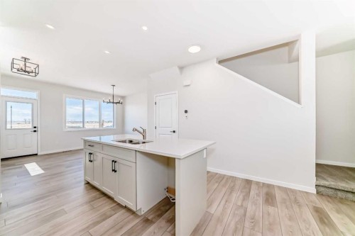 115 Montane Link Se, High River, AB - Indoor Photo Showing Kitchen With Double Sink