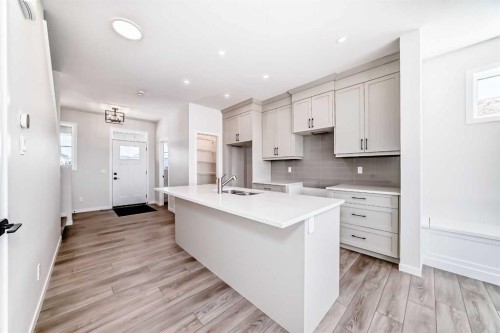 115 Montane Link Se, High River, AB - Indoor Photo Showing Kitchen With Double Sink