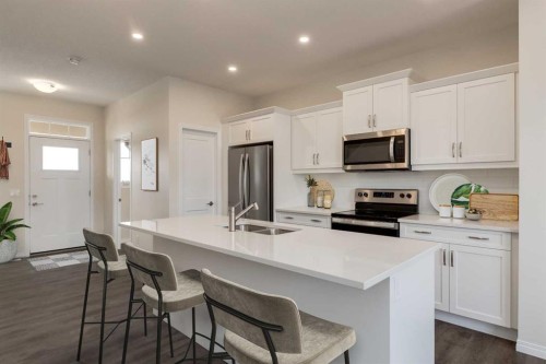 115 Montane Link Se, High River, AB - Indoor Photo Showing Kitchen With Double Sink With Upgraded Kitchen