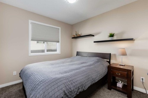 407 Morningside Crescent Sw, Airdrie, AB - Indoor Photo Showing Bedroom