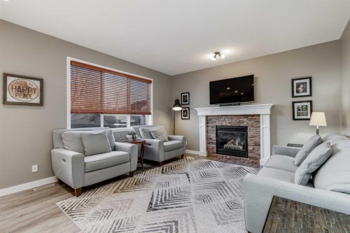 407 Morningside Crescent Sw, Airdrie, AB - Indoor Photo Showing Living Room With Fireplace